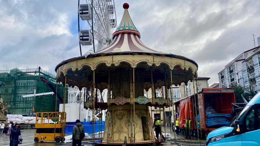 Últimos flecos en la instalación de la noria y el carrusel de Navidad de la Virgen Blanca