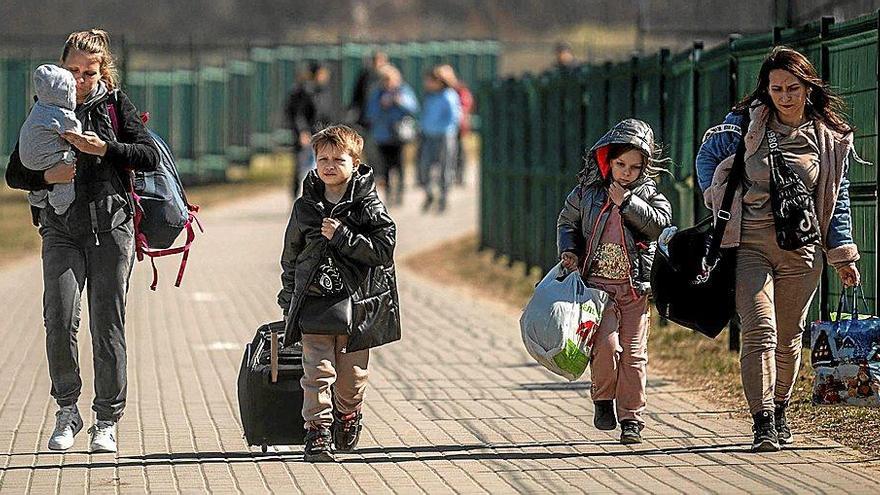 Refugiados ucranianos a su llegada a la frontera con Polonia, país que acoge al mayor número de personas.