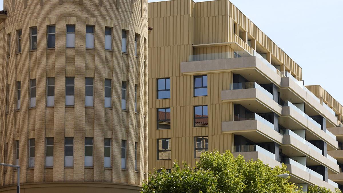 Una imagen del edificio y las viviendas acabadas.